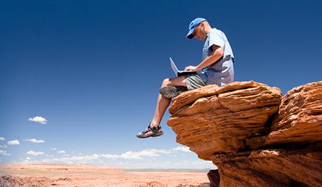 Man Sitting On a Rock